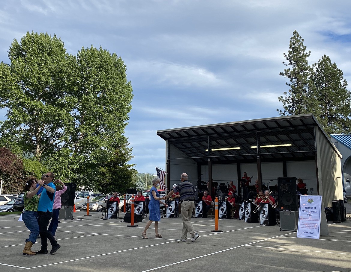 (MADISON HARDY/Press) 
 Couples get up and dance to the authentic big band music at the Hayden Concert Series on Thursday, hosted by Handshake Productions at McIntire Family Park.