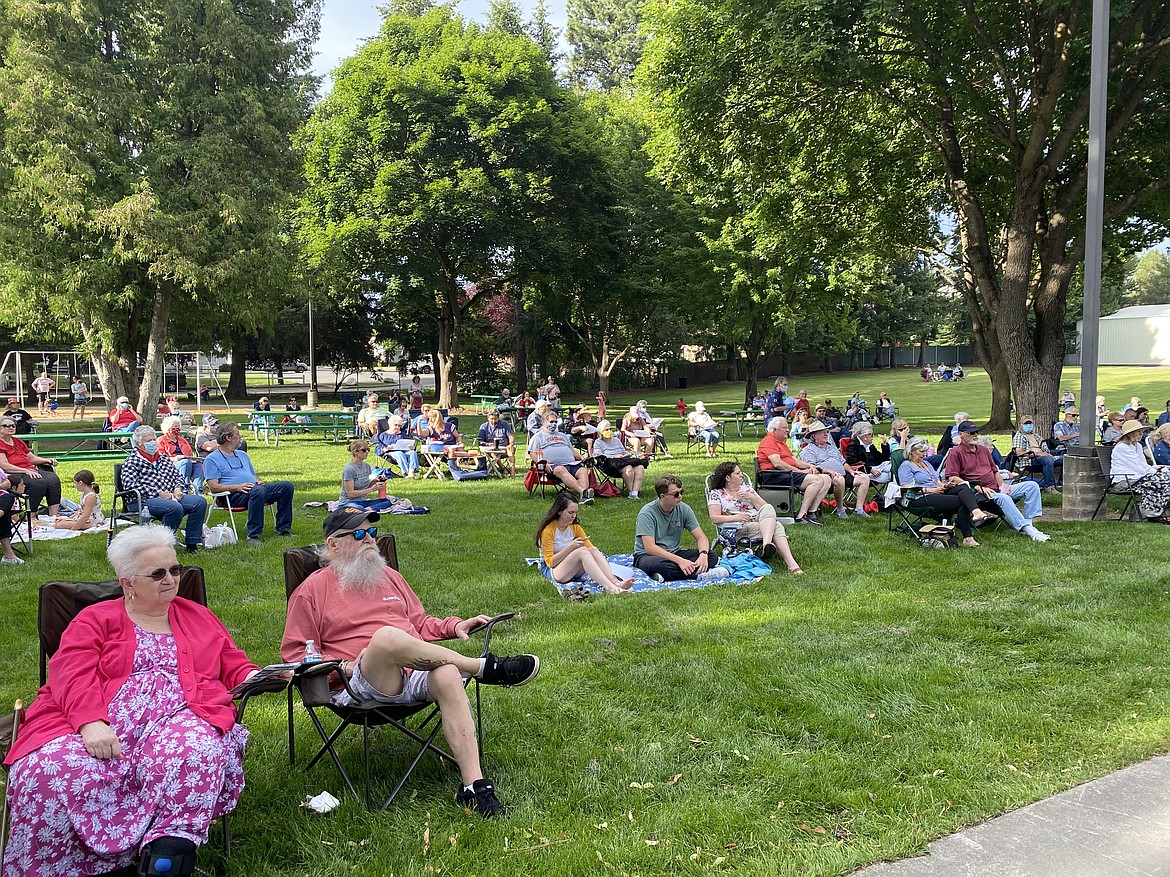 (MADISON HARDY/Press) 
 Onlookers at McIntire Family Park enjoy the Hayden Concert series Thursday sitting 6 feet apart with family, friends, and food.