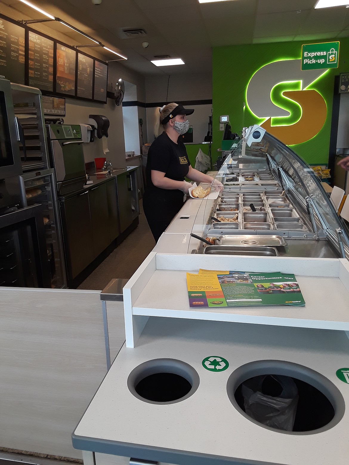 A sandwich artist at the Hess Street Subway in Hayden builds a customer’s sub Thursday, one day after its corporate office announced a new policy requesting customers not open carry in its more than 23,000 stores nationwide, including in states like Idaho, where open carry is legal. Patrons legally carrying concealed handguns are still permitted.
