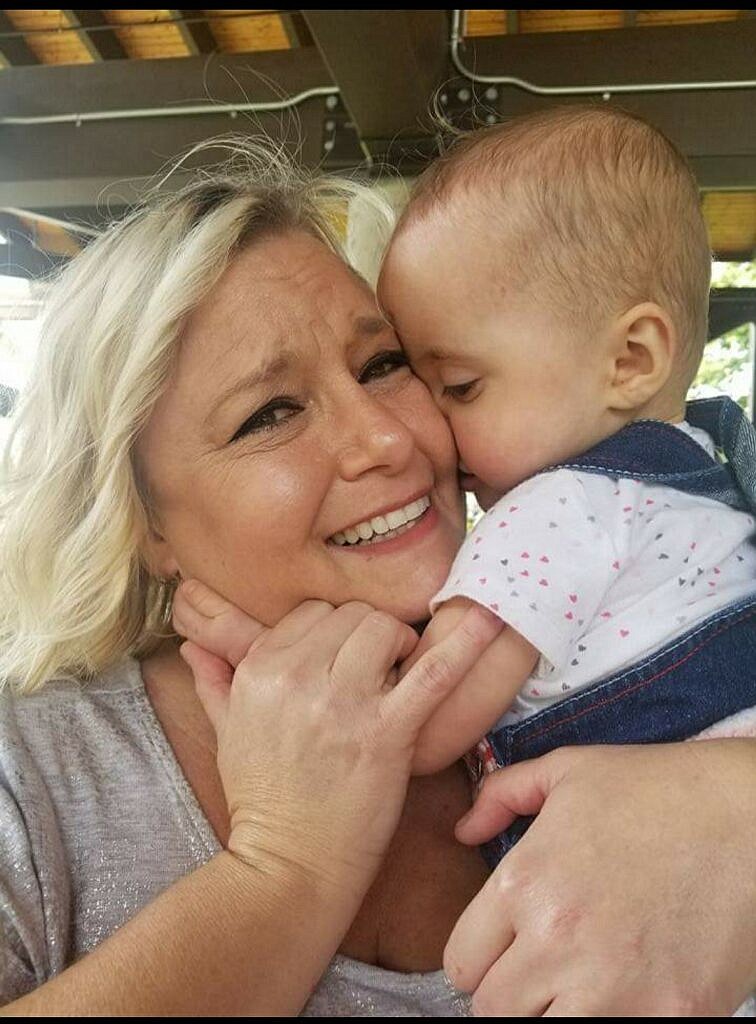 Nurse Shannon Tottenham Gisclair shares a moment with Bellanie at the first NICU reunion in 2018. (Photo/Leondra Holman)