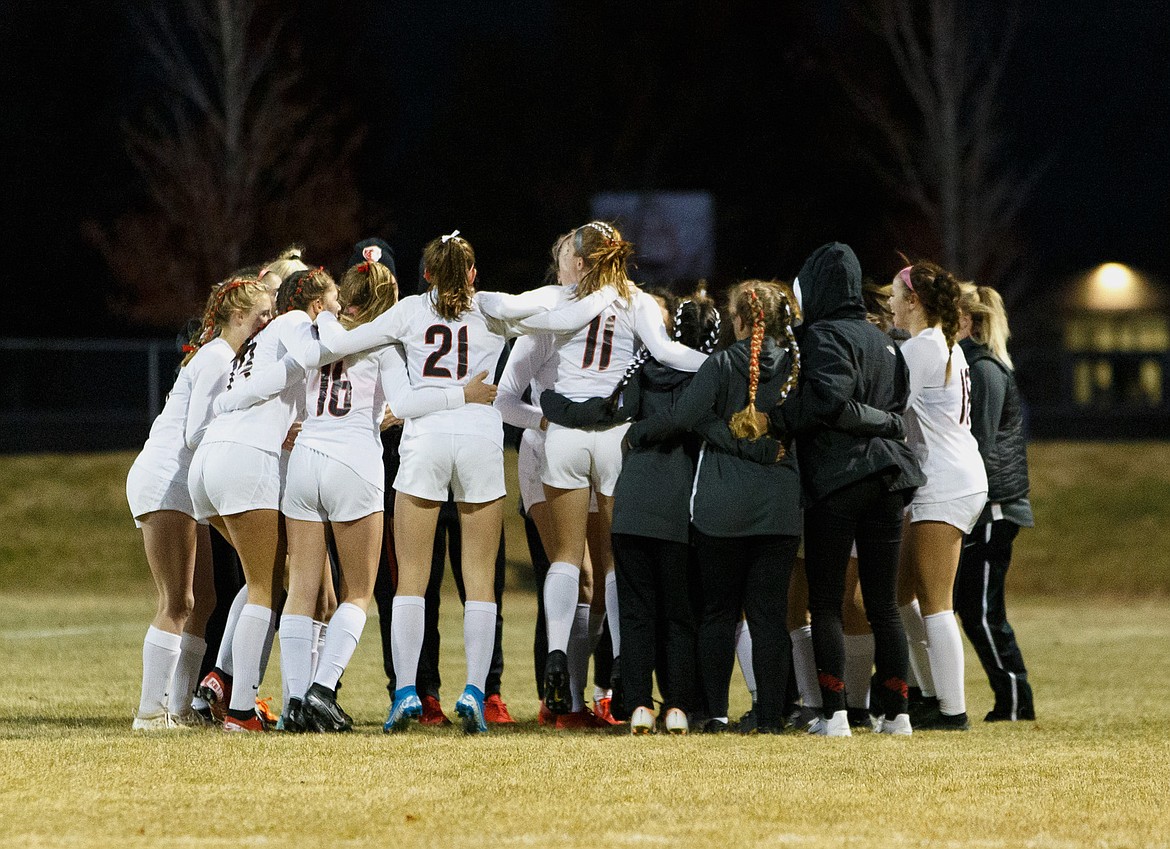 The Sandpoint girls soccer team huddles prior to last year’s 4A state championship match against Kuna. The Idaho High School Activities Association released guidelines for the fall season Thursday.