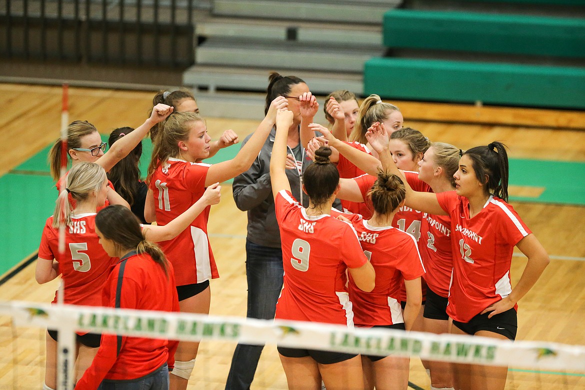 Sandpoint volleyball breaks it down following a timeout during a match at Lakeland last year.