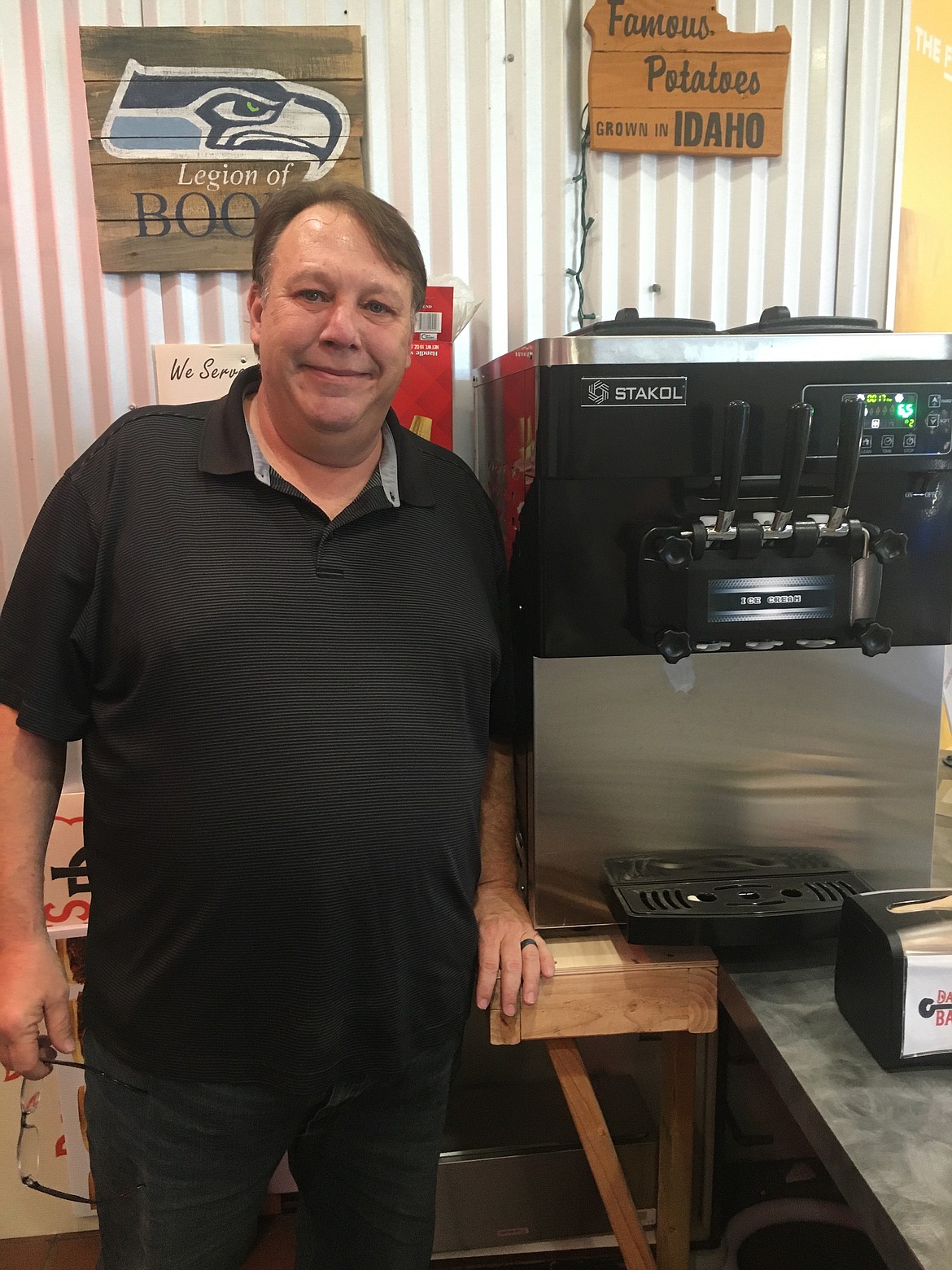 Courtesy photo 
 Owner David Hart stands by the soft serve machine at David James Ice Cream & Snack Bar, now open in the Silver Lake Mall food court.