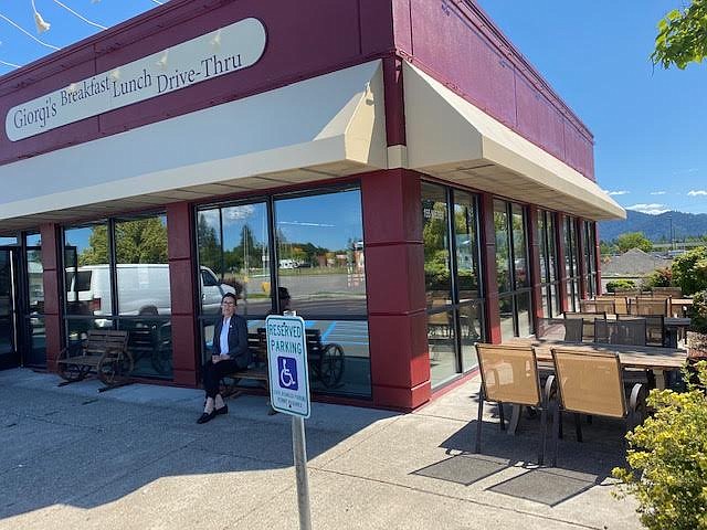 Employee Dawn Robinson sits outside the new Giorgi’s Restaurant at 155 W. Neider Ave. The renovated location formerly was Roger’s Ice Cream & Burgers.