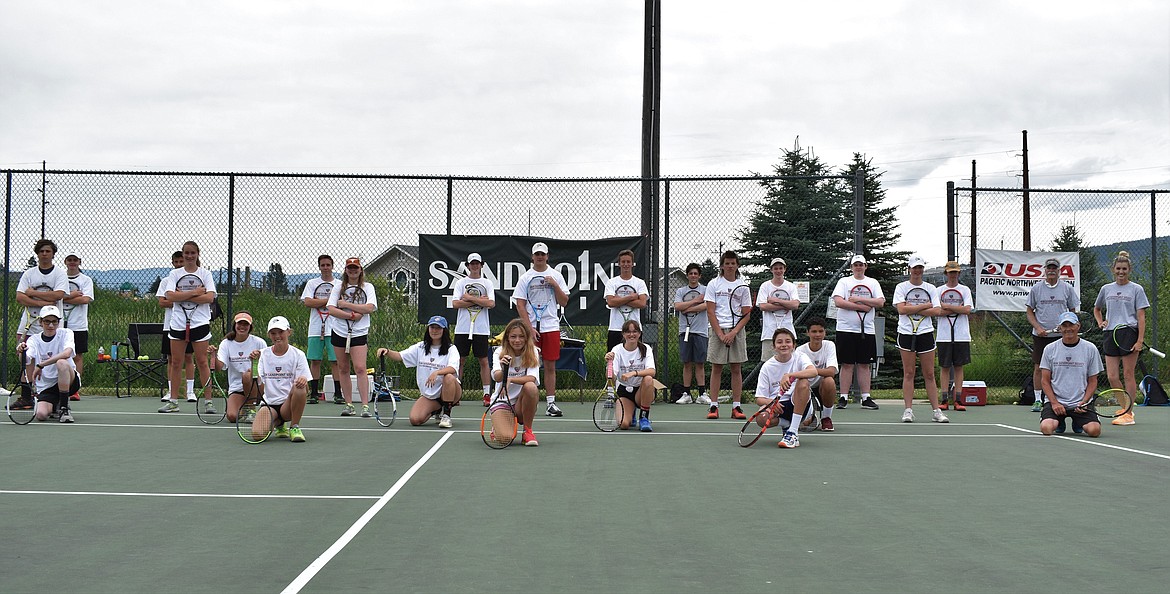 Athletes taking part in the Sandpoint tennis team’s annual summer camp pose for a socially-distanced photo Friday at Travers Park.