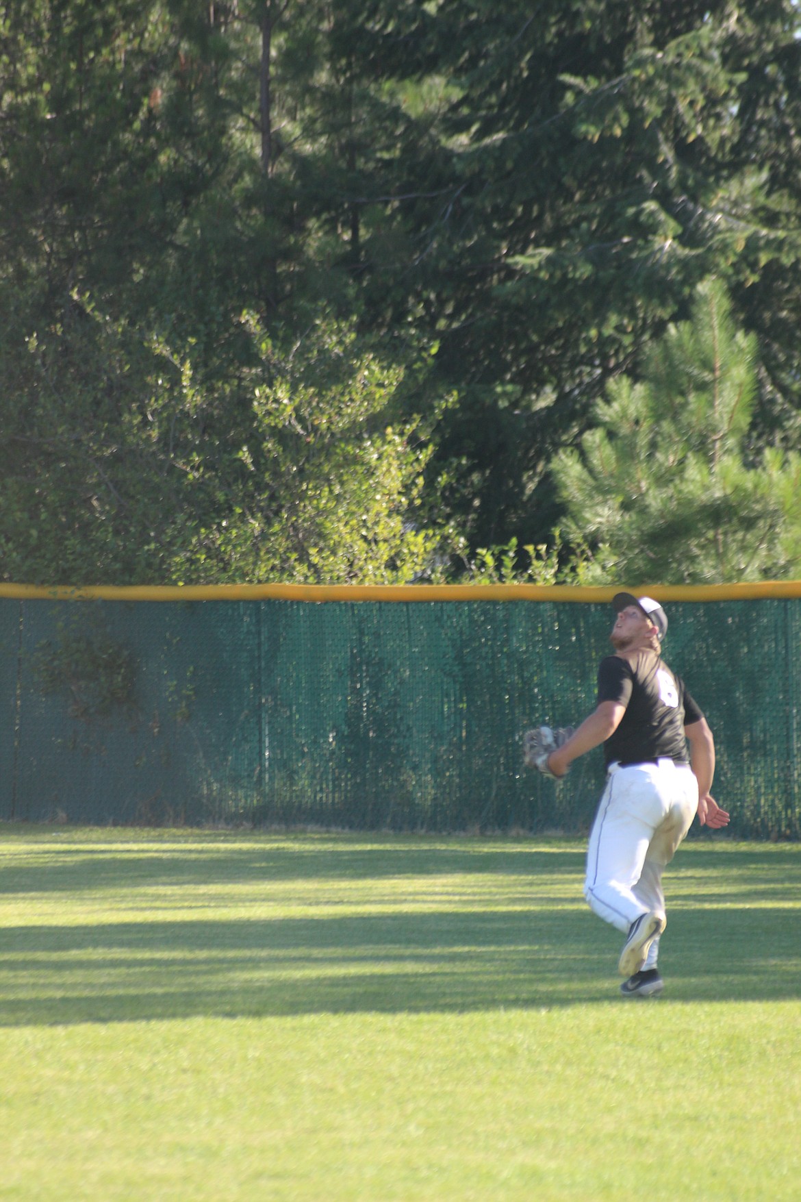 Northern Lakes outfielder Scott Pote tracks down a fly ball in right-center during the Mountaineers’ 4-3 win over the visiting Coeur d’Alene Lumbermen on Monday evening at Gorton Field in Rathdrum.