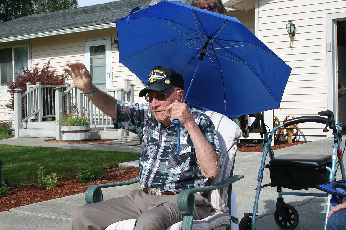 World War II veteran Geb Galle was saluted for his 99th birthday with a parade of fire trucks, law enforcement vehicles, led by the Patriot Guard Riders motorcycle group Sunday. Moved to tears by the tribute, Galle waves to the parade.