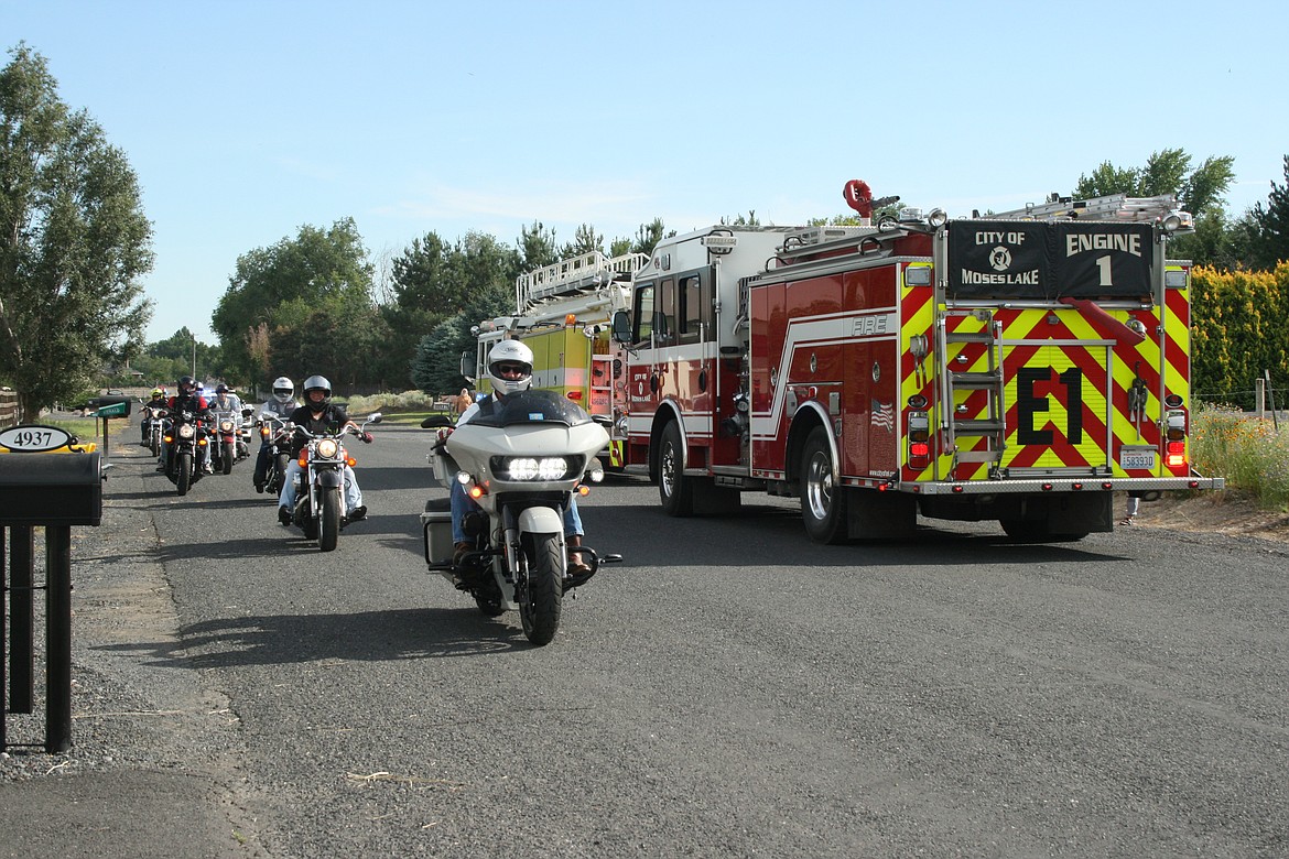 Members of the Patriot Guard Riders motorcycle club, fire trucks and law enforcement vehicles staged a parade Sunday in honor of Geb Galle, a World War II veteran, for his 99th birthday.