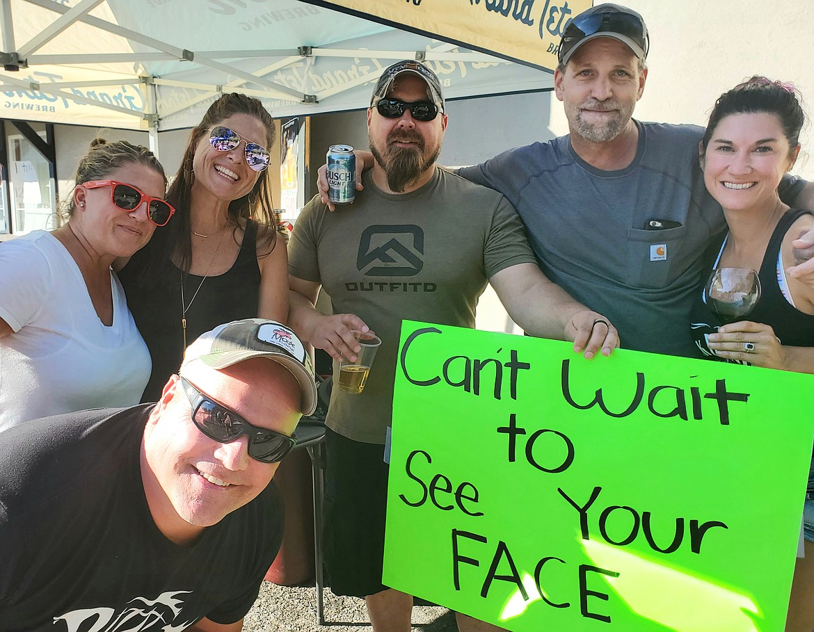 From left, Natalie Couch, Kevin Price (front), Joanna Ivy, Alan Kemmis, Mike Rucker and Jamie Lee can’t wait to see Jay Schrank’s face again as they gather for a fundraiser at O’Malley’s Sports Pub and Grill on Monday evening. The event brought in about $15,000 for the Schrank family to help with expenses as Jay recovers from severe injuries he sustained during a helicopter crash in June. (Courtesy photo)