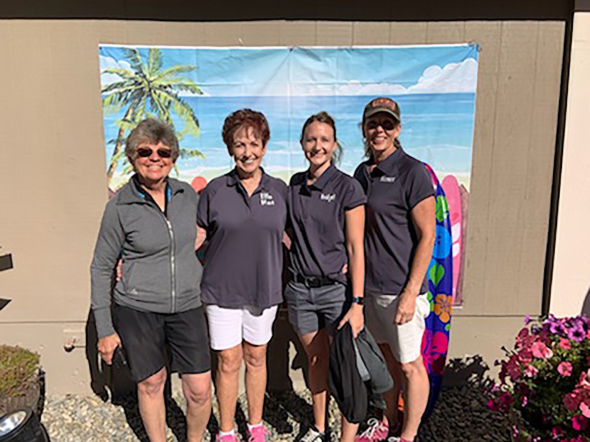 Participants in the Mirror Lake Ladies’ Golf Association’s special annual summer “Margaritaville” open 18-hole golf tournament pose for a photo.