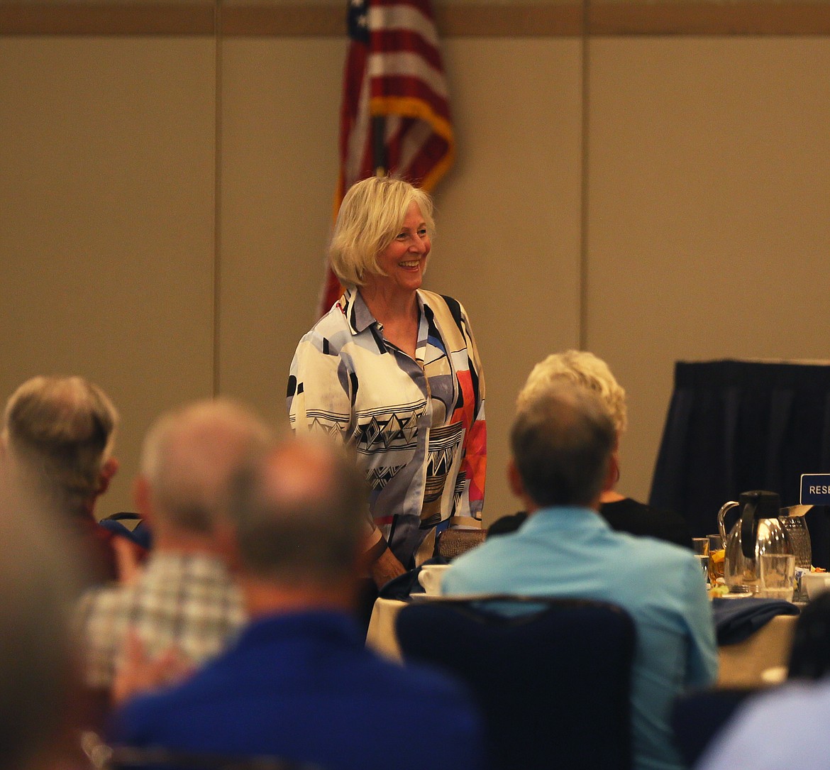 Vicki Risch, a former first lady of Idaho and Sen. Jim Risch’s wife of 52 years, says hello to Rotary members during a meeting in The Coeur d’Alene Resort on Friday. (DEVIN WEEKS/Press)