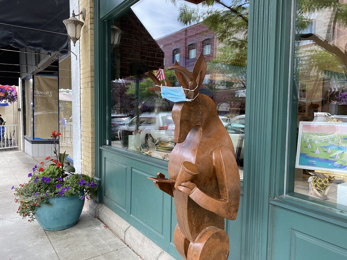 A deer statue in downtown Coeur d’Alene is adorned with a mask in compliance with the Panhandle Health District mask mandate.