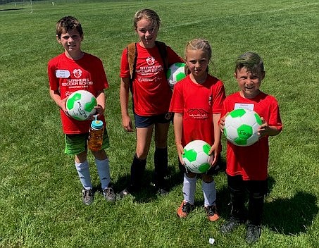 From left: Aiden Player, Blaire Jenkins, Nina Tajan and Easton Chartrey were named Premier 1 Campers of the Day at the Sandpoint Strikers summer camp on July 15.