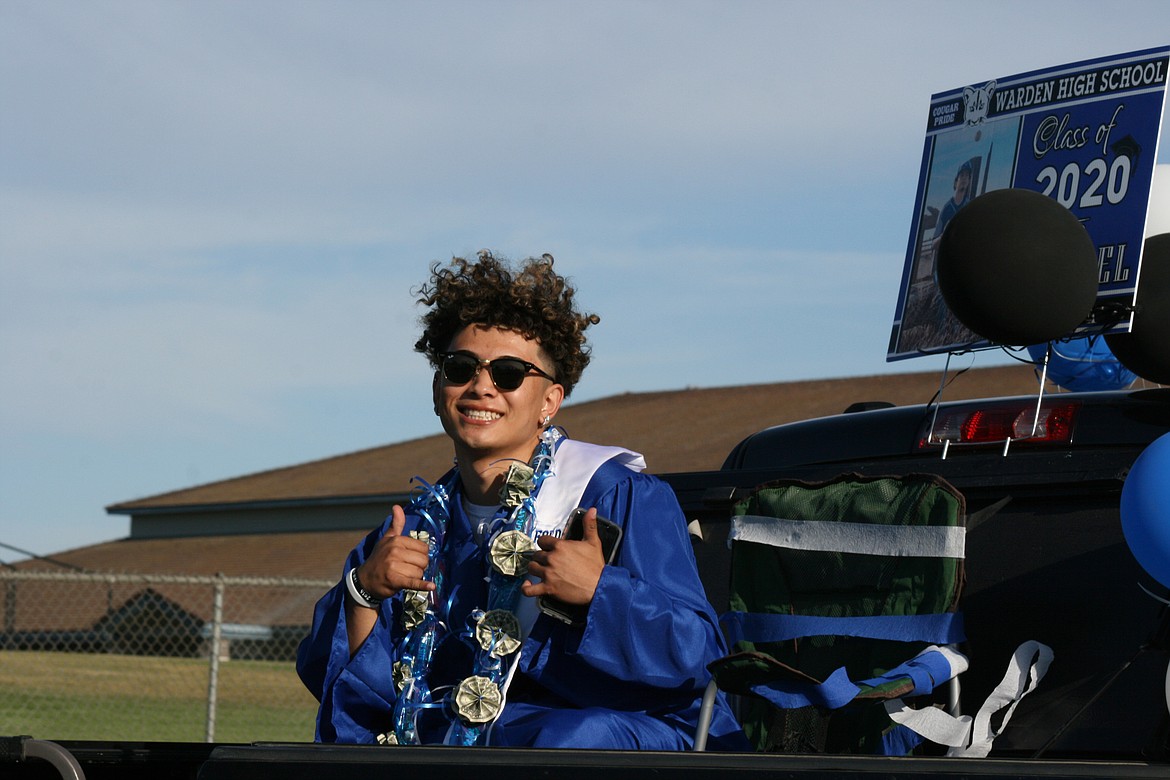 Cheryl Schweizer/Columbia Basin Herald 
  
 A Warden High School senior is ready for the ceremony as the Class of 2020 enters the campus for graduation Friday night.