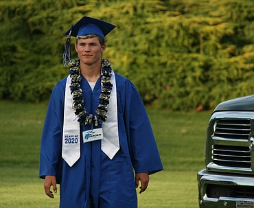 Cheryl Schweizer/Columbia Basin Herald 
  
 A Warden High School senior approaches the stage during graduation ceremonies Friday.