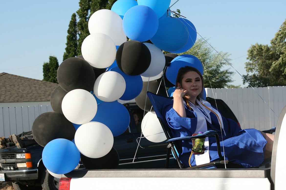 Cheryl Schweizer/Columbia Basin Herald 
  
 A Warden High School senior enters the campus in style during graduation ceremonies Friday night.