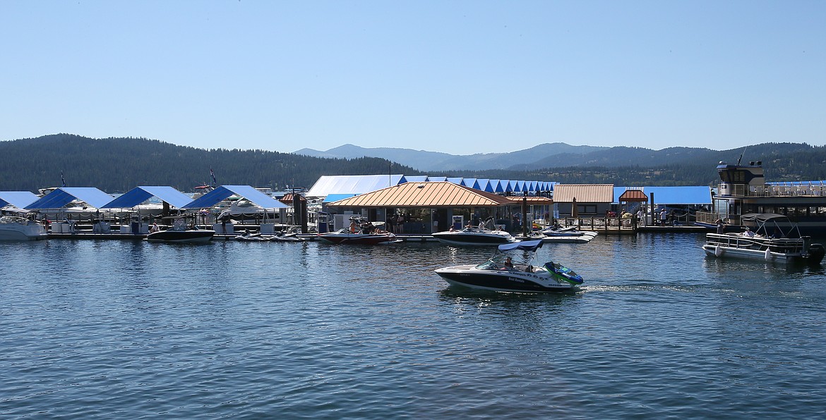 Boats and watersports are a popular getaway on Monday as people head to the lake to cool off. A heat advisory is in effect until Thursday night, and a burn ban goes into effect Wednesday as fire danger in Kootenai County is elevated to high. (DEVIN WEEKS/Press)