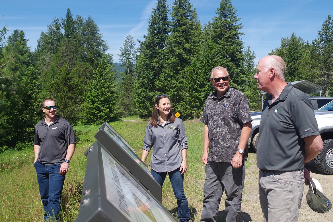 The parties involved in a major conservation achievement at the McArthur Lake Wildlife Management Area gather at the site recently. From left: Chad McElvany, Molpus Woodlands Group; Karen Neorr, IDL Forest Legacy Program; Barry Dexter, Stimson Lumber Company; and Scott Ketchum, Hancock Natural Resources Group.