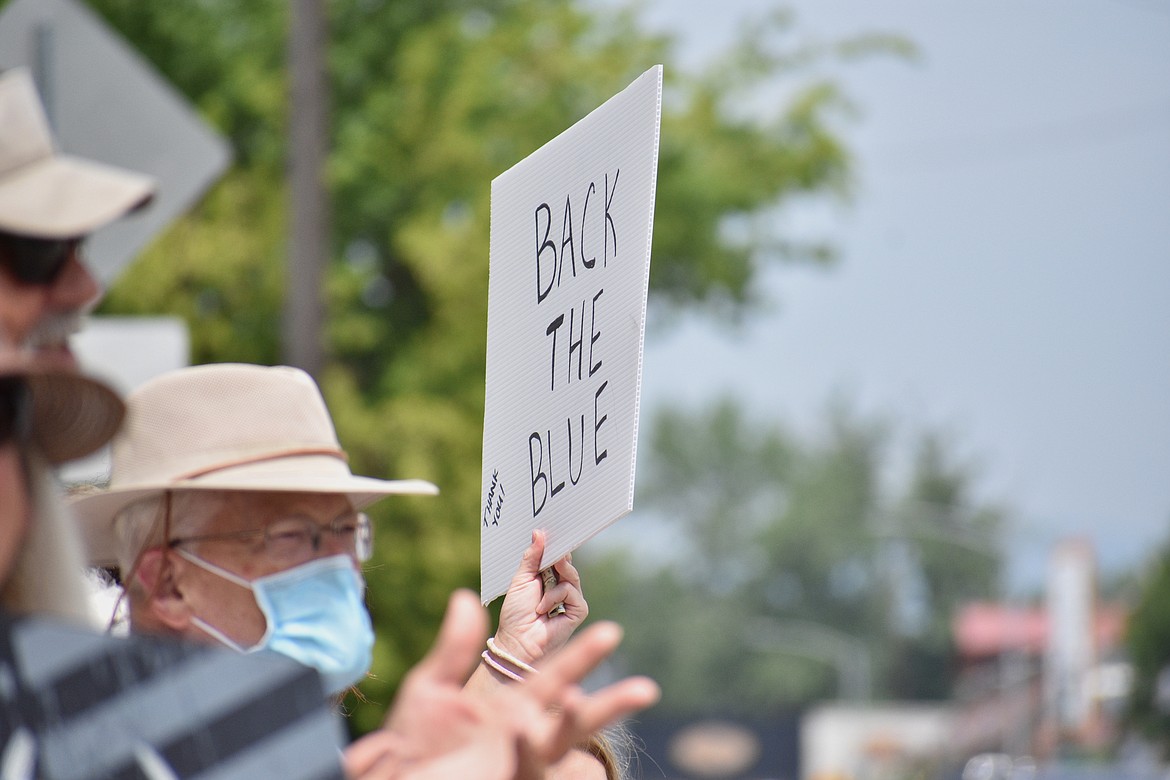 (Photo by DYLAN GREENE)
A sign that says “Back the Blue” is held up during Saturday’s event.