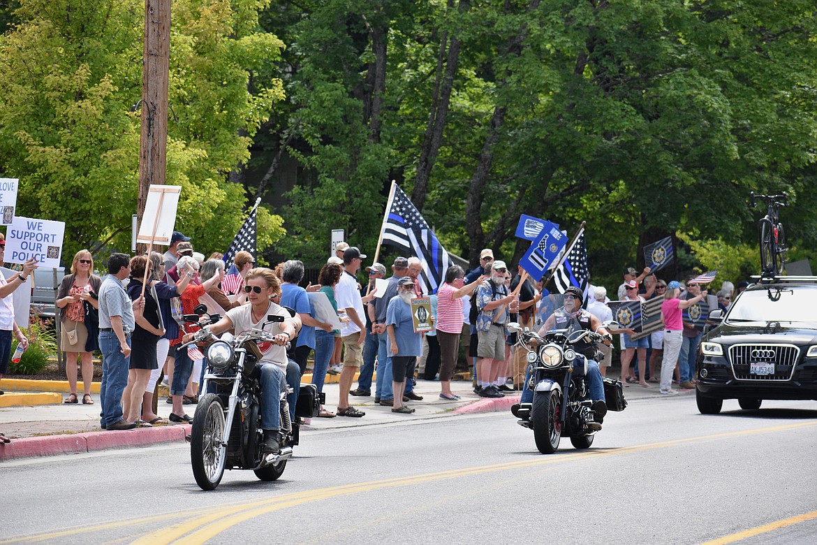 (Photo by DYLAN GREENE) 
 Lots of people who drove by the Back the Bonner Blue event honked their horns, cheered and waved to support local law enforcement.