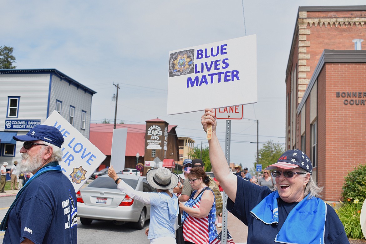 (Photo by DYLAN GREENE)
A woman holds up a “Blue Lives Matter” sign during Saturday’s event.