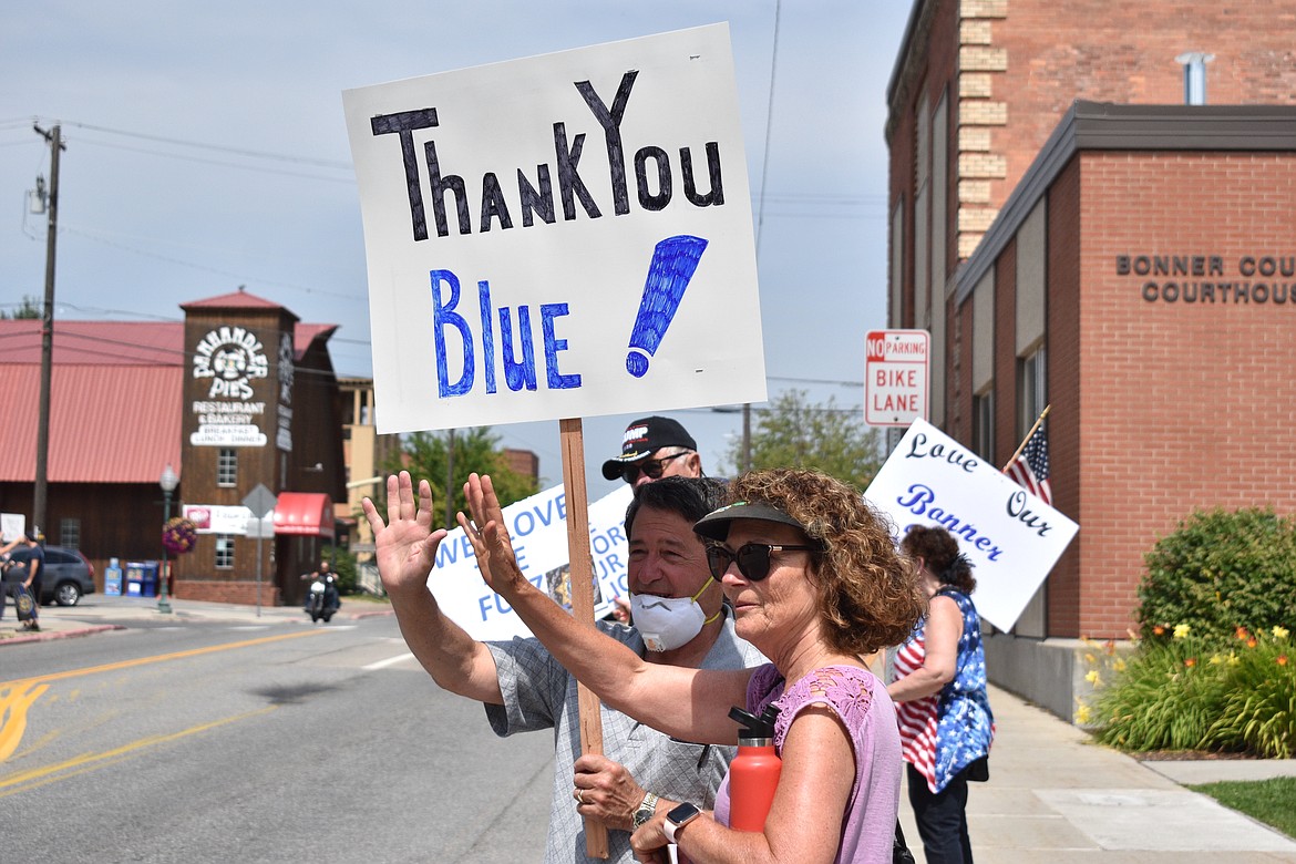 (Photo by DYLAN GREENE)
Mike Clark, 67, holds a sign that says, “Thank You Blue!” during Saturday’s rally.