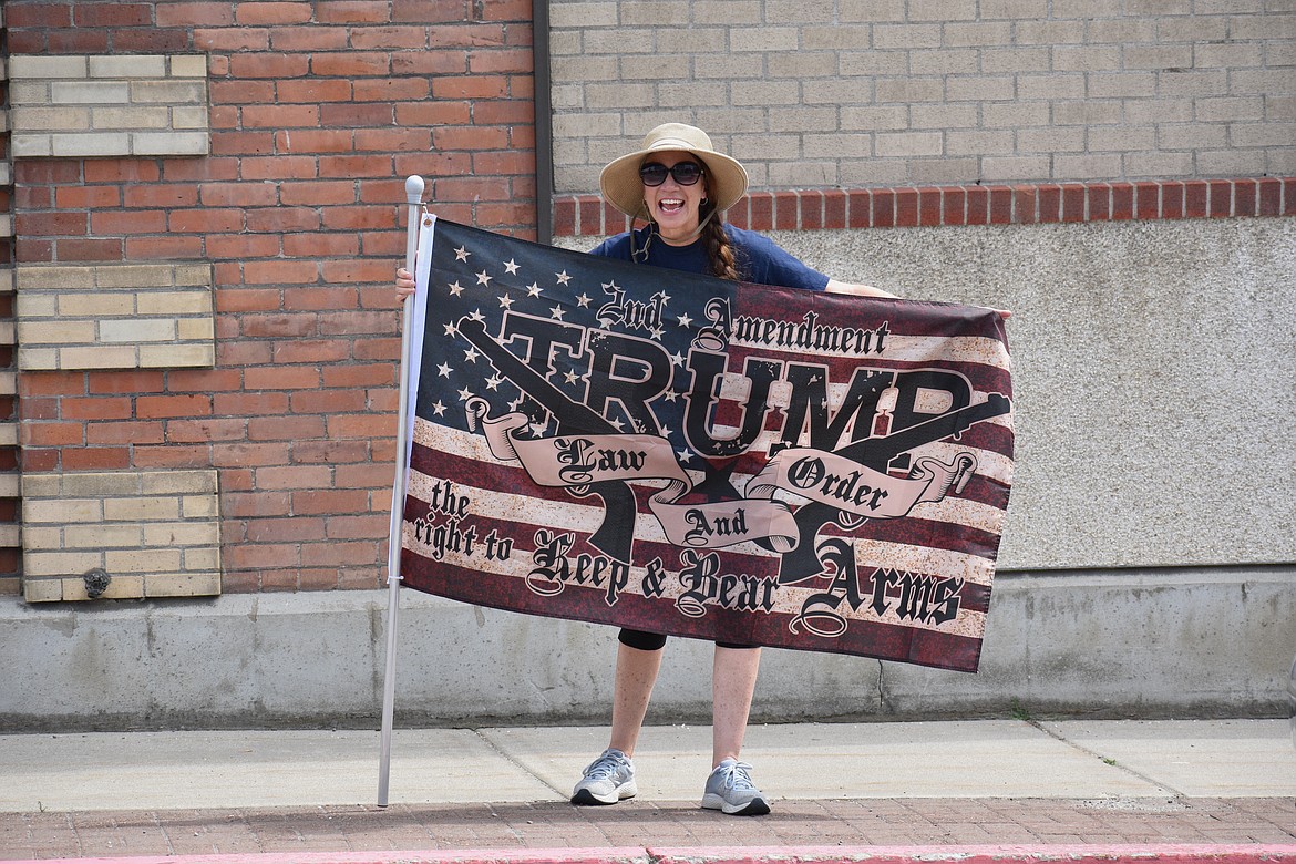 (Photo by DYLAN GREENE)
A woman holds up a flag supporting President Donald Trump and the Second Amendment during Saturday’s event.