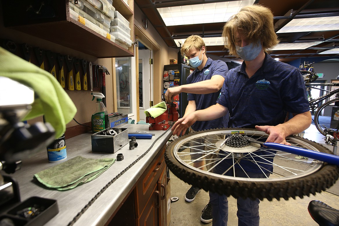 Joseph Hoisington and Jackson Brosell work in the bike shop at Mountain View Cyclery.