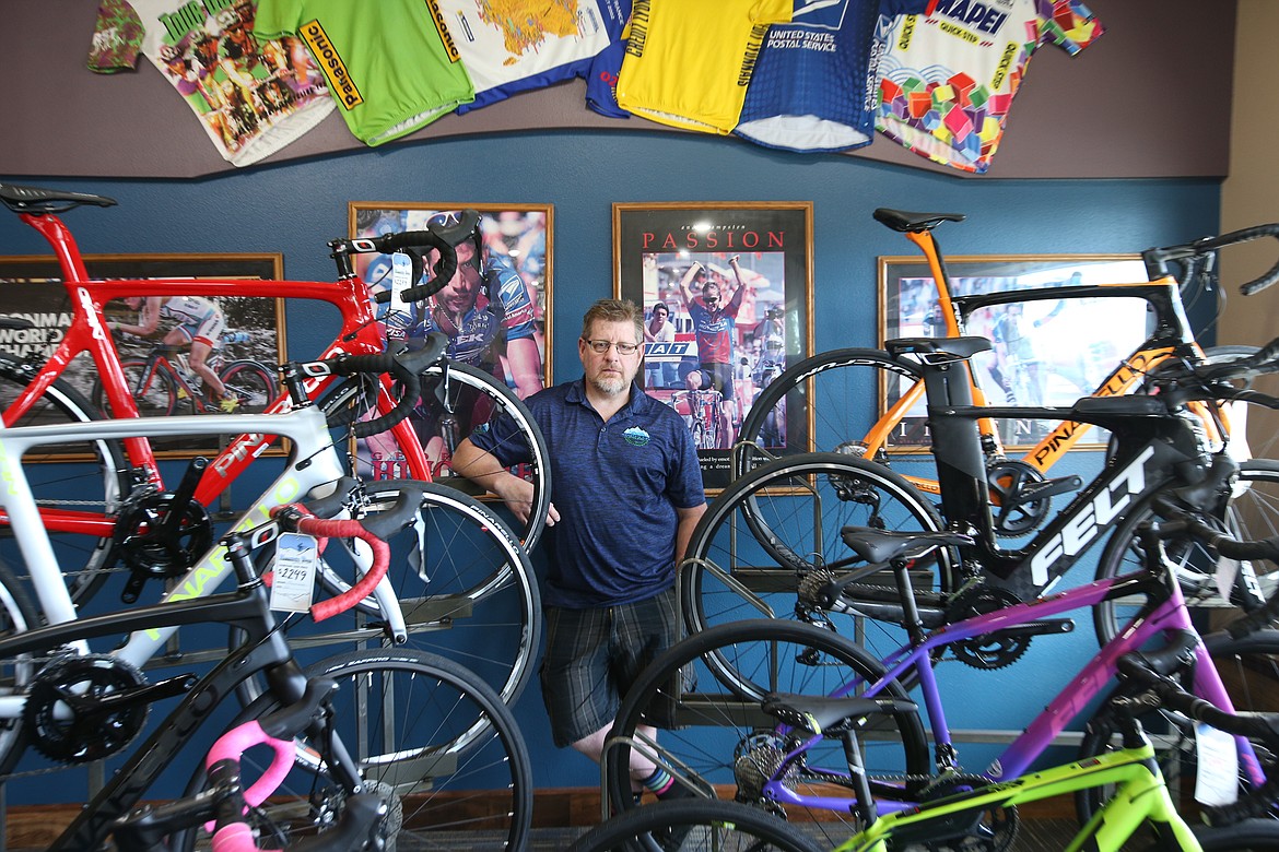 John Bowman, owner Mountain View Cyclery, stands near some of the bikes available at his Hayden shop. (BILL BULEY/Press)