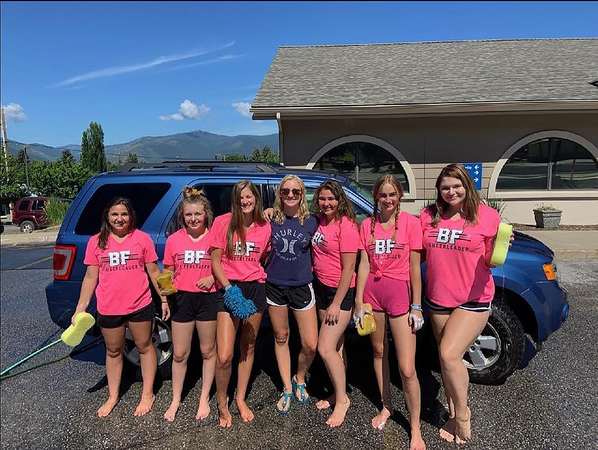 (Courtesy photo) 
 Bonners Ferry High School cheerleaders take a moment for a quick photo before getting to work at their recent car wash.