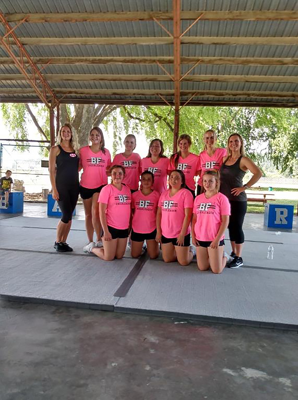 (Courtesy photo)
Bonners Ferry High School cheerleaders pose with some of the Iron Mike’s crew.