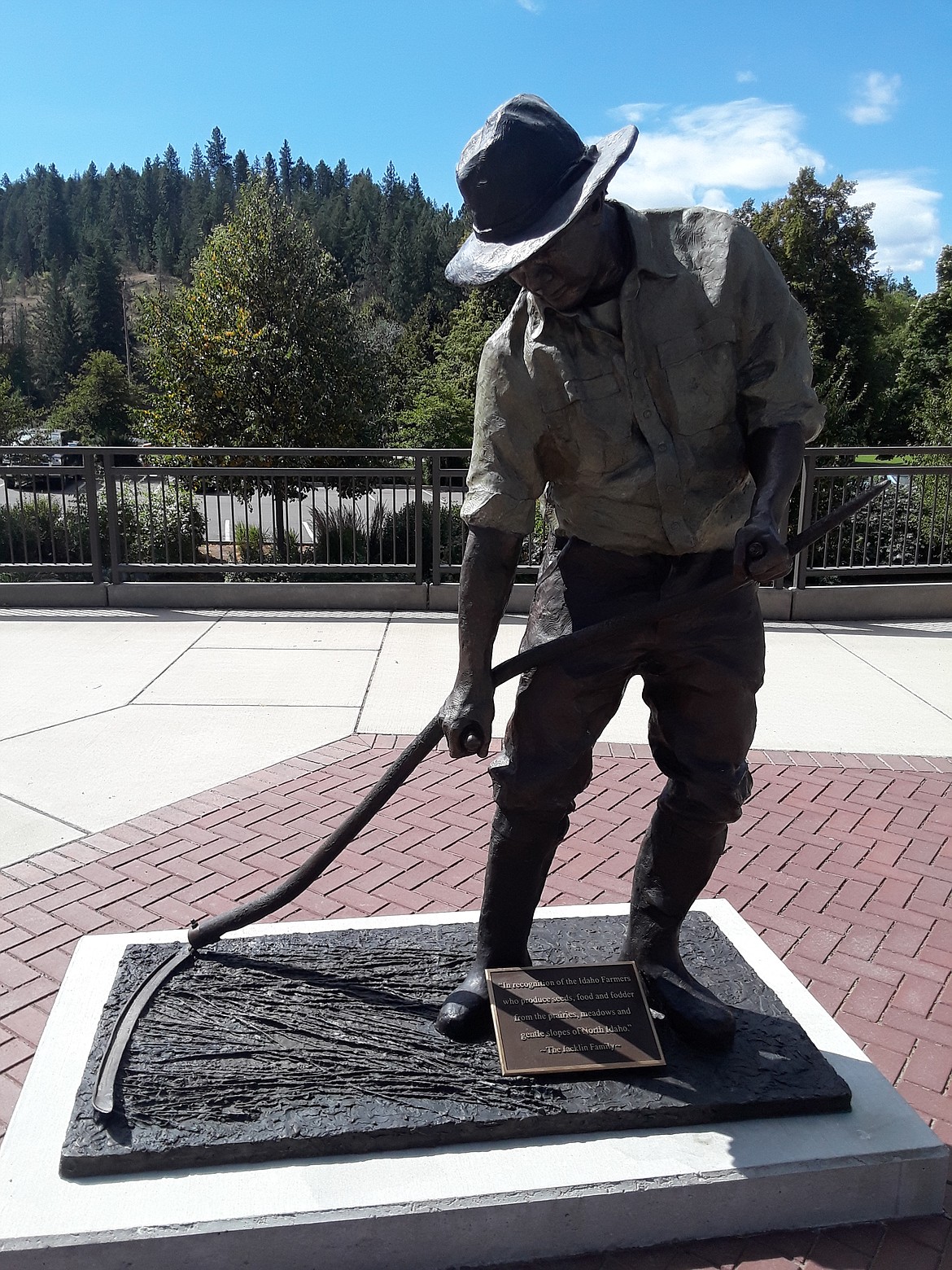Terry Lee’s “The Idaho Farmer” is one of three statues he created that stand along Front Street in Coeur d’Alene, telling the history of the people who built the West we see today. Alongside “The Idaho Farmer,” “The Idaho Lumberjack” and “The Working Man,” Lee’s newest installment — “The Suffragist” — will be installed Aug. 18. (CRAIG NORTHRUP/Press)