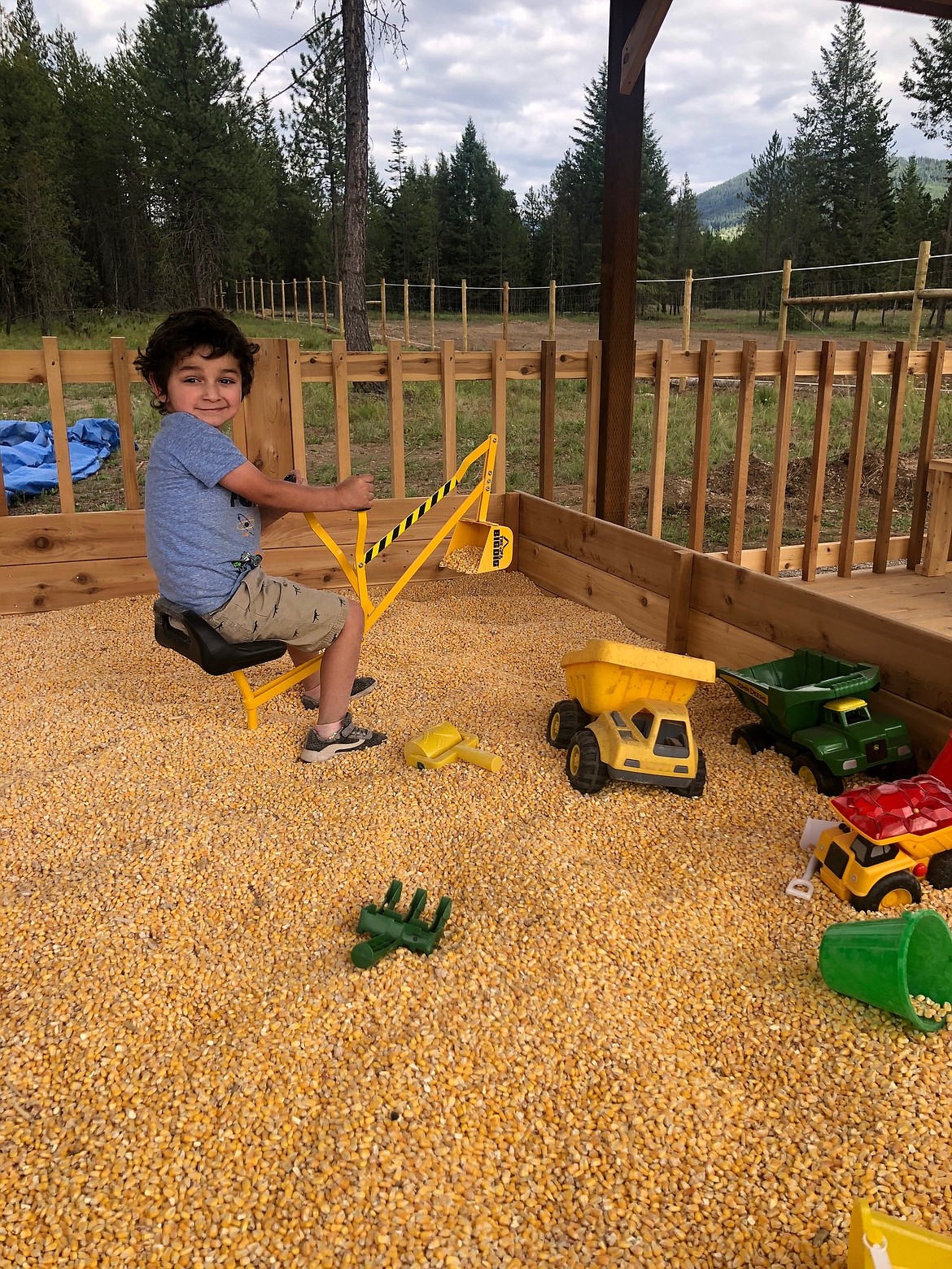 Courtesy photo
Monty and Laura Winter’s grandson, Ollie Winter, plays in the corn pit.