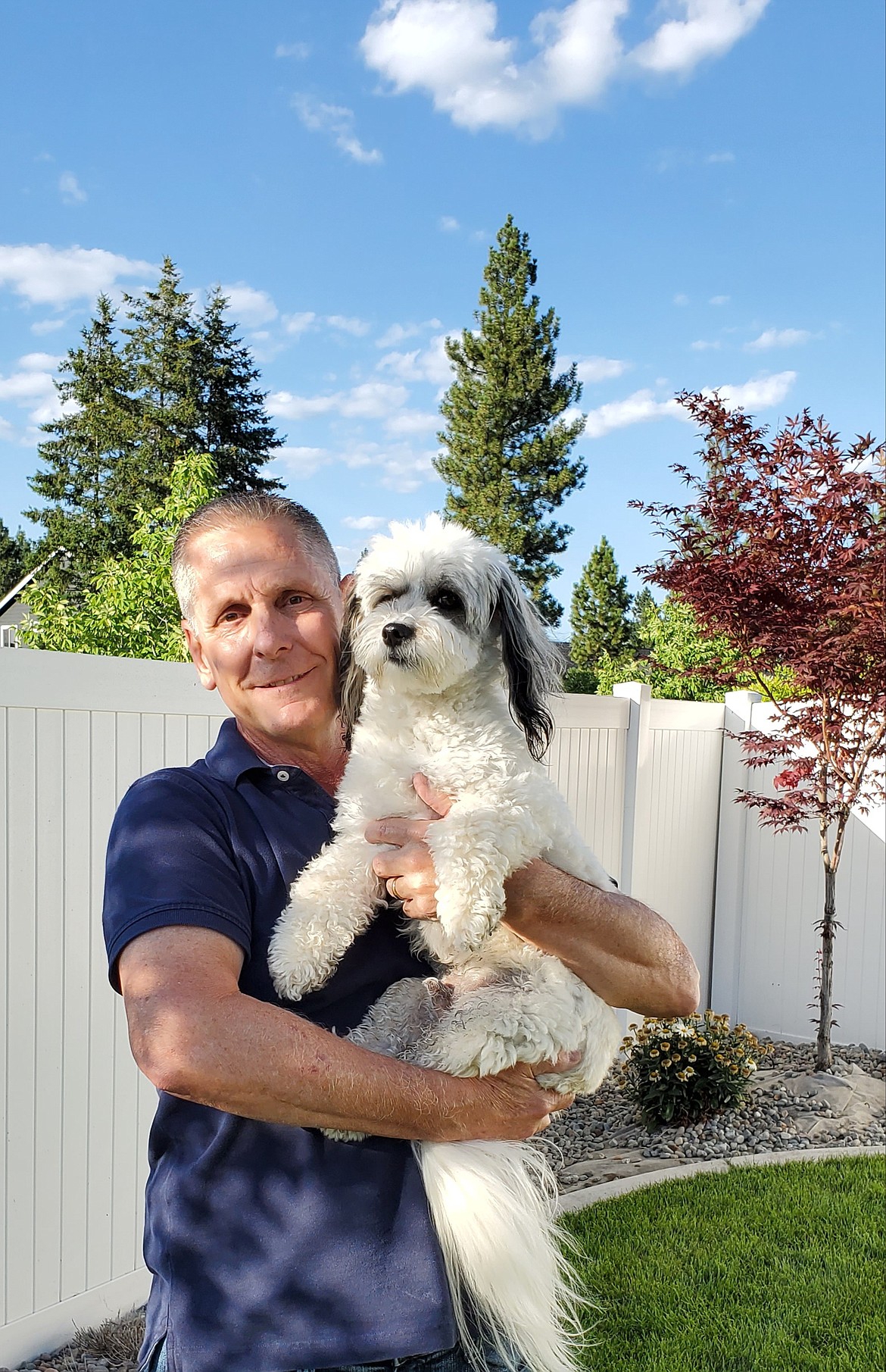 Courtesy photo 
 Select K9 Resort owner Robert West with Jake the dog. The Post Falls business is now open at 221 E. Railroad Ave.