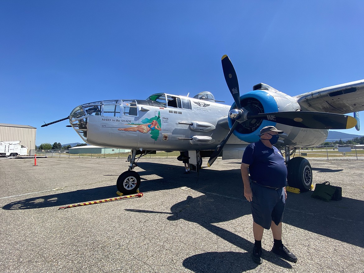 Ground operator and ride coordinator Mike Mueller talks about the history of the World War II warplane the "Maid in the Shade." (MADISON HARDY/Press)