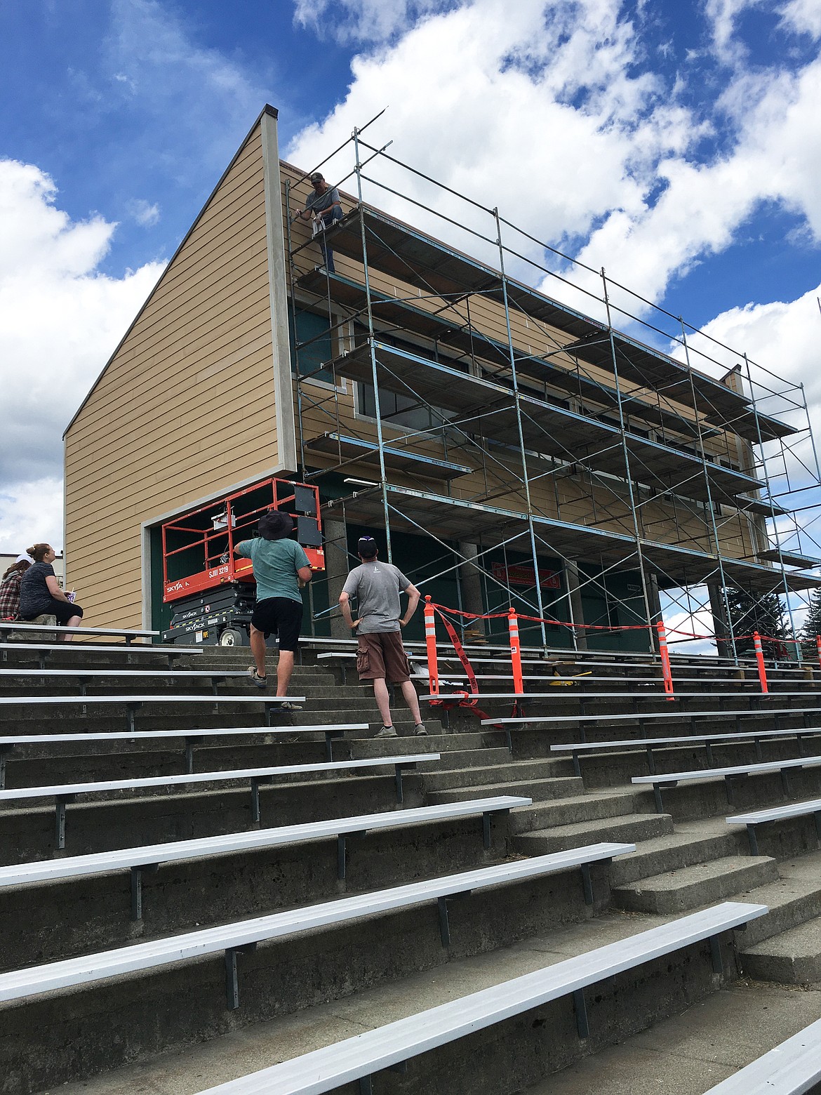 Volunteers climb scaffolding to refurbish the Lakeland High School press box/concession stand, a legacy project jump-started by $4,000 invested by the class of 2020. The finishing touches are now being put on the project, which will be complete by the end of summer.