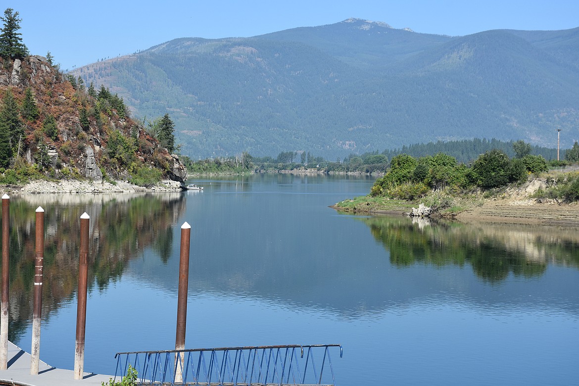 The boat dock west of town, the Kootenai River, Ambush rock, and the distant Selkirk Mountains ARE a familiar site in the summer.