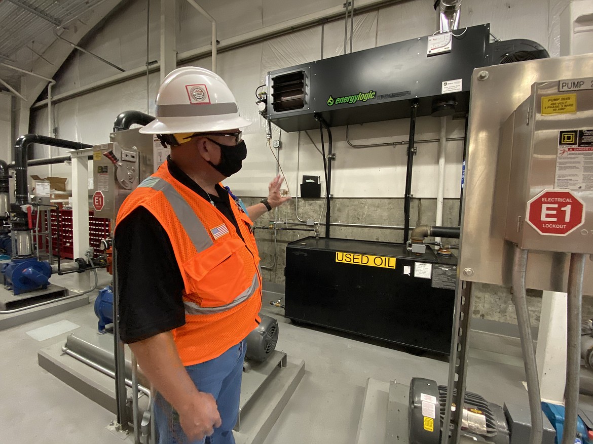 John Jeffery, the Hauser Fueling Depot maintenance and compliance manager, shows off their used-oil burner which reuses oil waste to heat the facility. (MADISON HARDY/Press)