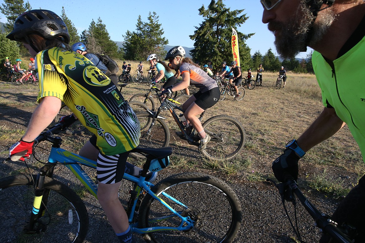 Riders pedal away Wednesday night at Farragut State Park. (BILL BULEY/Press)