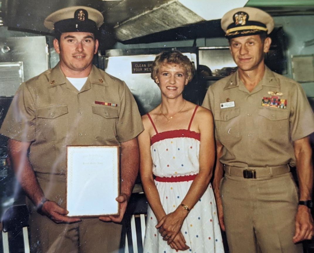 Dave Sheldon, left, receives his chief petty officer ranking in Aug. 1983, joined by wife Carla Sheldon (now of 45 years) and Capt. Charles I. Cook of the USS Jason (AR8). Sheldon, now 67, will jump out of a plane on Sept. 11 to raise funds for Newby-ginnings, a local veteran nonprofit, as well as the 9/11 Health Watch nonprofit that supports 9/11 responders and their families. (Courtesy photo)