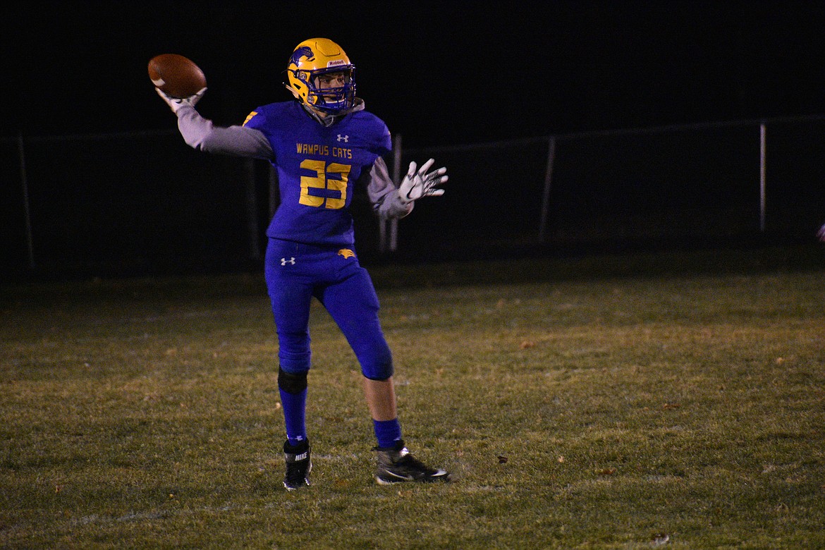 (File photo by DYLAN GREENE) 
 Carter Sanroman attempts a pass during Clark Fork's homecoming game last season.