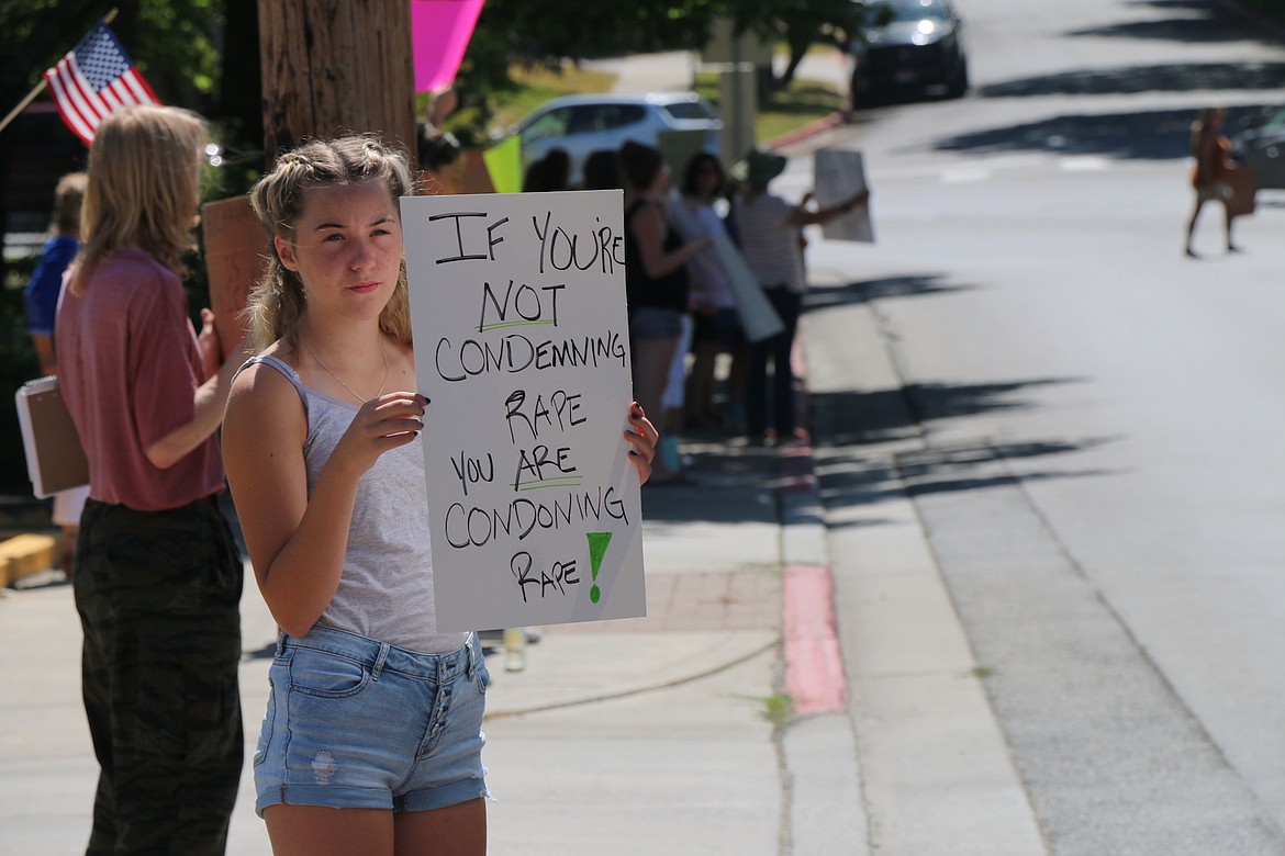 (Photo by KEITH KINNAIRD) 
 Protesters object to a sentence imposed in a sexual exploitation case on Monday.