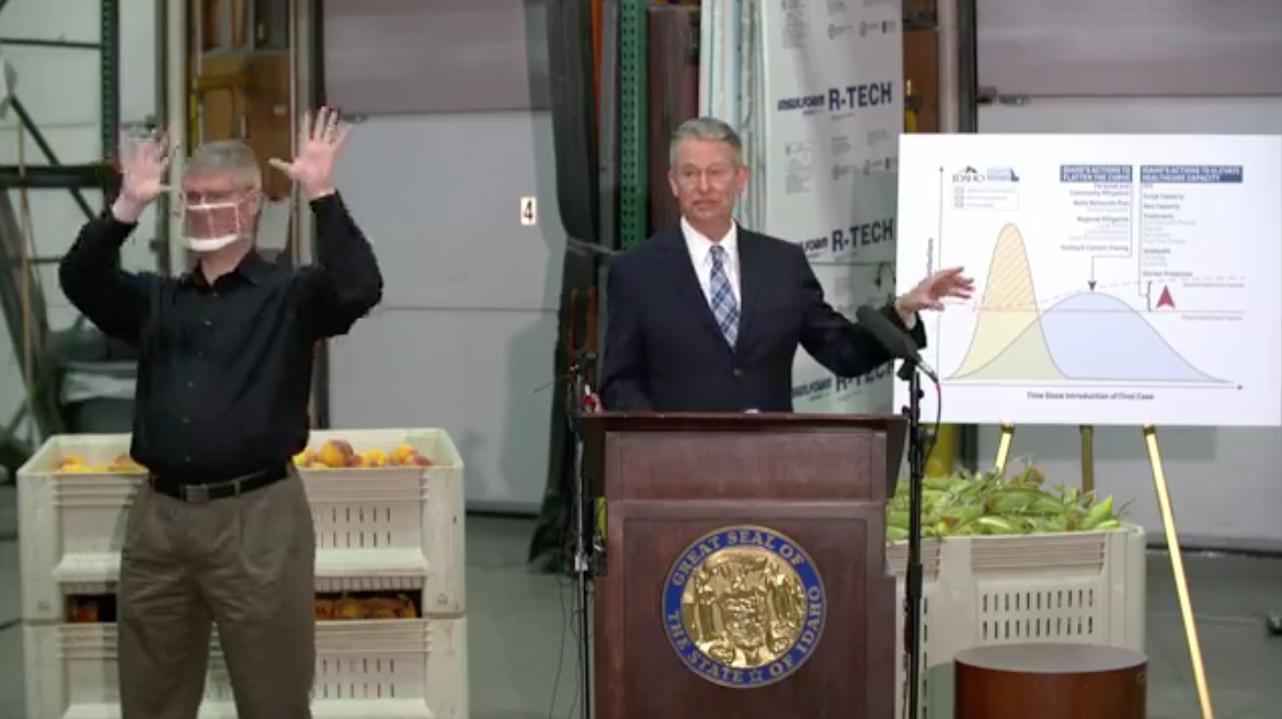 Gov. Brad Little (center) is joined Friday by his beloved and now-famous American Sign interpreter, Steven Stubbs, to go over the COVID-19 numbers in Idaho. While the state will remain in Stage Four of his Idaho Rebounds plan for at least another two weeks, Little said he was encouraged by some of the state's trends. (Courtesy of Idaho Public Televsion)