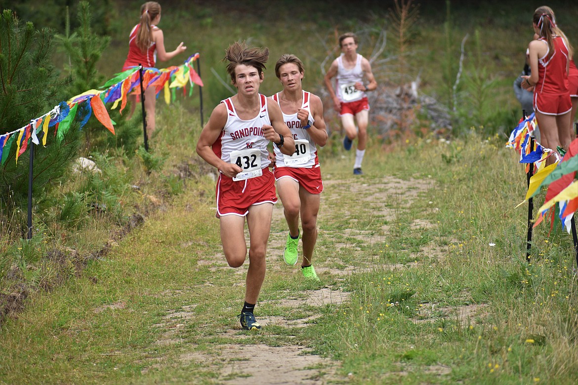 Trey Clark (front) leads Slate Fragoso and Nathan Roche toward the finish of Friday’s dual.