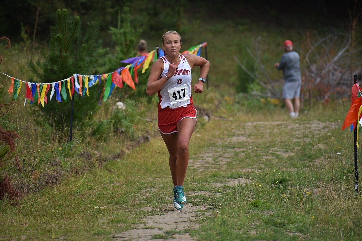 (Photo by DYLAN GREENE) 
 Sophomore Ara Clark nears the finish line during Friday's dual meet against Timberlake.