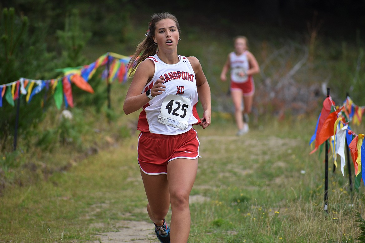 (Photo by DYLAN GREENE) 
 Junior Megan Oulman nears the finish line in Friday's dual.