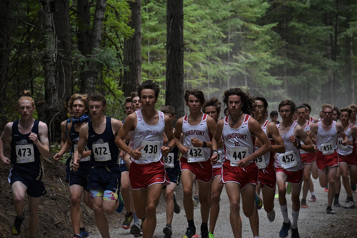 (Photo by DYLAN GREENE) 
 The Sandpoint and Timberlake boys charge out of the gates during Friday's dual.