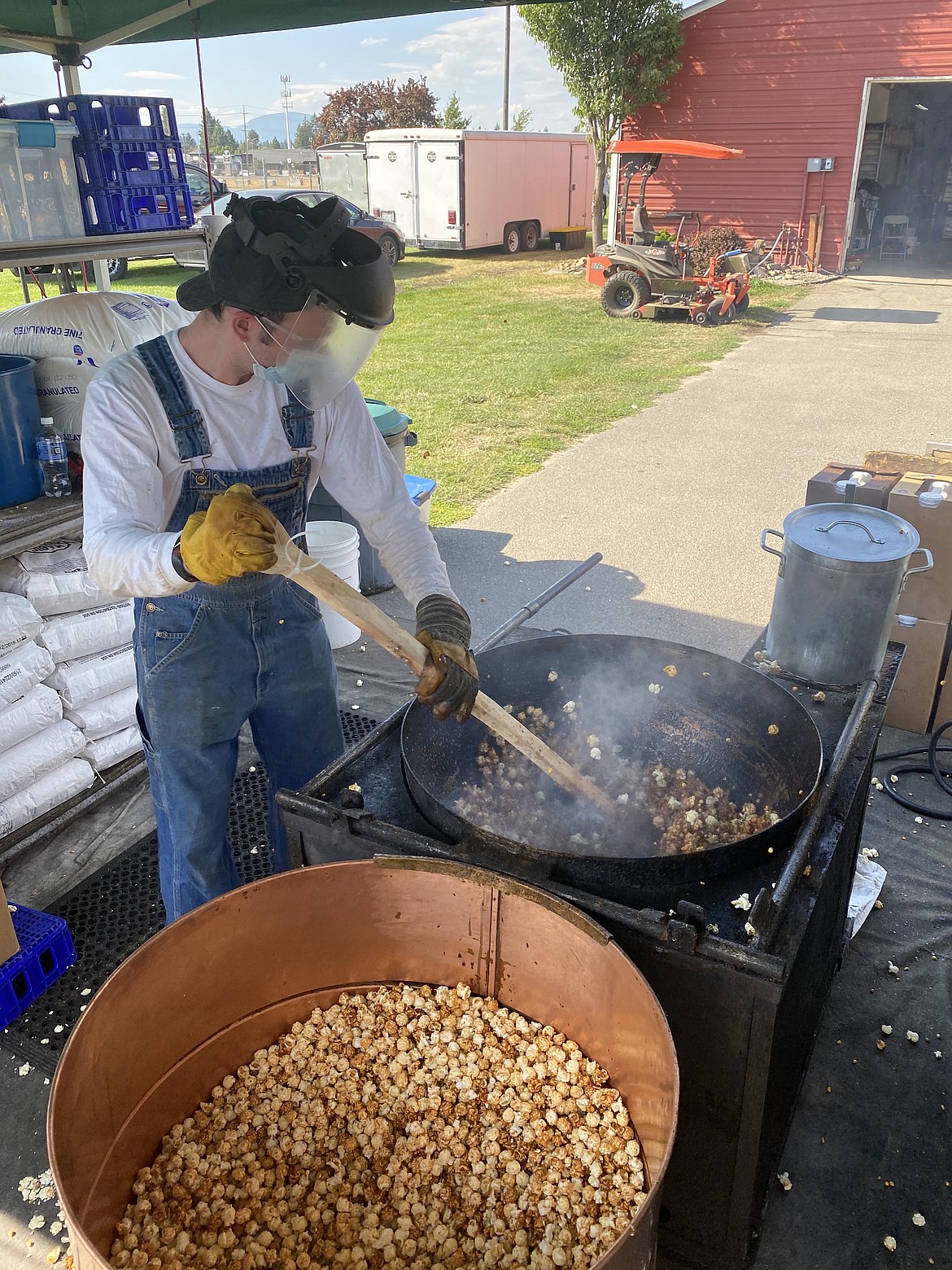 Old Fashion County Kettle Corn wipes up their famous carmel corn  at the North Idaho State Food Fair Fix event Friday evening. (MADISON HARDY/Press)