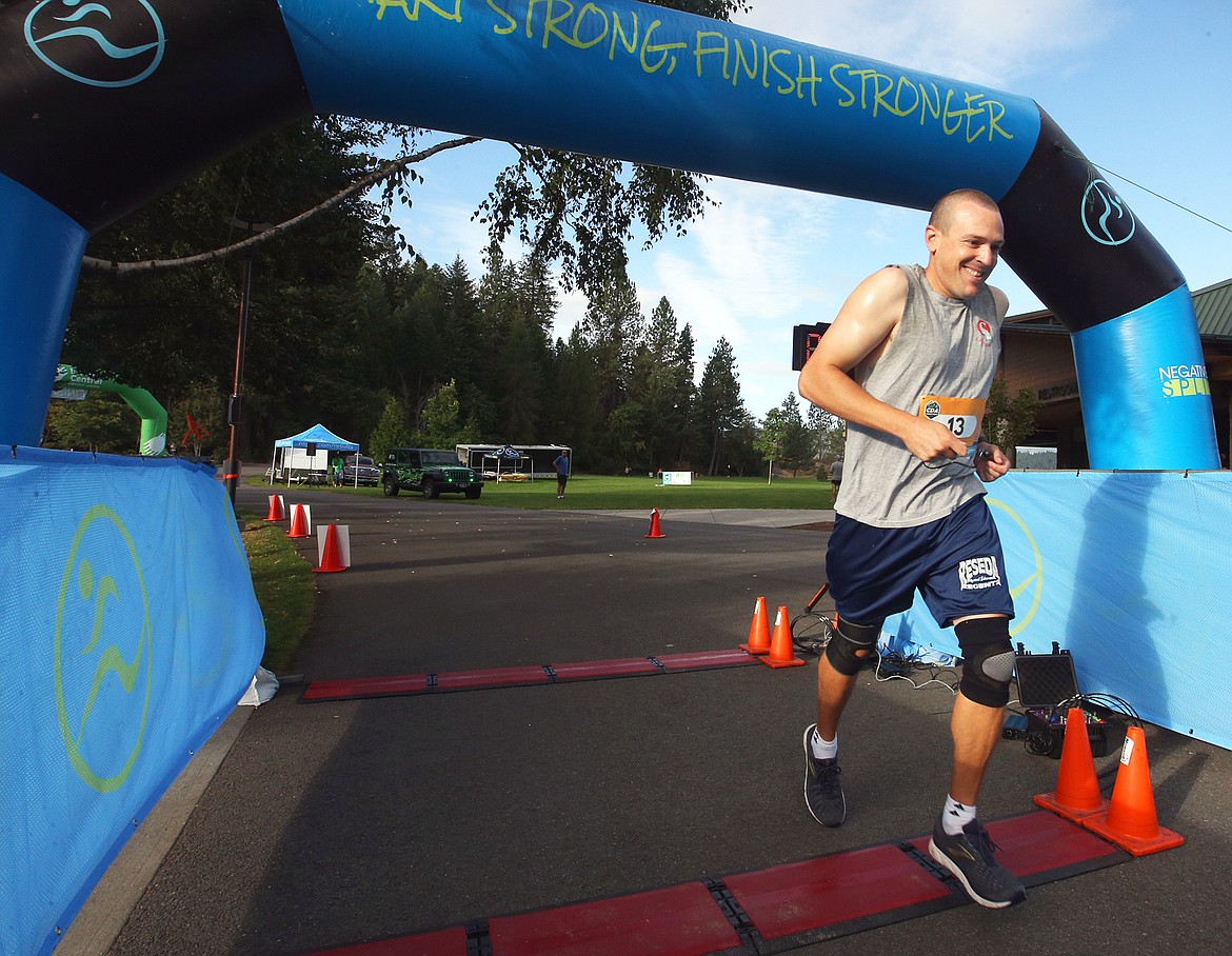 Thomas Hughes of Coeur d’Alene starts from McEuen Park to run the Coeur d’Alene half marathon on Saturday, which featured mild morning temperatures perfect for exercise.