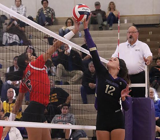 Lena Pawlowski (12) battles a Browning player during a match in the 2019 volleyball season. Pawlowski recently signed a letter of intent to play volleyball at the University of Providence starting in fall of 2020. (Bob Gunderson photo)